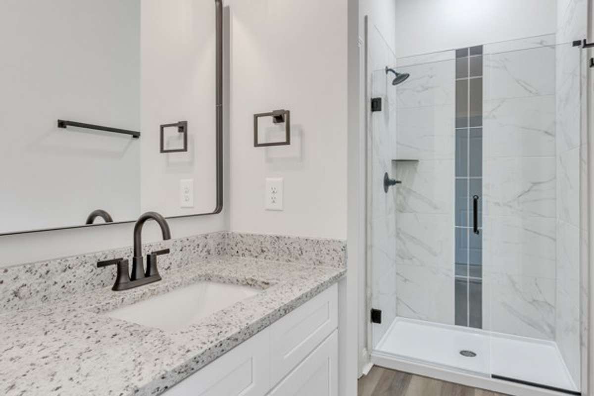 With 10ft ceilings, granite & elegant tile this owner's bath has a real spa feeling. (Private water closet area to left of shower)