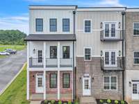 Welcome to 179 Charleston Ave! Coveted END unit with covered porch and 2 additional decks!