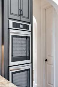 All-new stainless steel double ovens add a sleek, modern touch to this gourmet kitchen—perfect for entertaining or everyday ease.