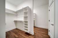 This walk-in dual spaced master closet can accommodate a large wardrobe and provide just enough privacy to share.