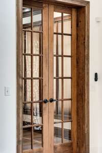 Beautiful French doors lead into the formal office, offering classic charm and privacy with elegant glass panes and rich wood tones.