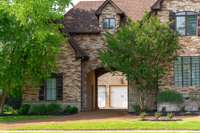 Spacious 3-car garage with porte-cochère entry offers elegance and functionality. Ideal for entertaining and everyday living with ample covered parking.