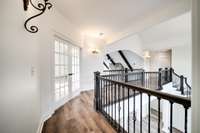 The bonus room with french doors is easily accessible near the guest rooms.