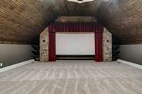 New carpet, wood ceilings, a projector and big screen provide the ultimate movie experience. All you need is some popcorn and friends to get this party started.
