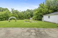 Back patio area overlooking the raised garden beds and large backyard....