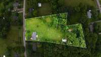 Overhead view showing off those full 3 acres. Notice the large pond at the back of the property.