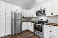 Filled with cabinets and all of the stainless appliances will remain