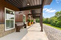 This covered porch off of the rear of the Lighthouse... sit down with your Sweet tea or your Ski and sip away!