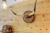 Sit at the bar and I will tell you the story behind these very horns once belonging to the meanest bull in Middle Tennessee...
