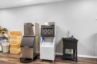 Wash sink along side the ice machines in the storage room also could be a tandem garage