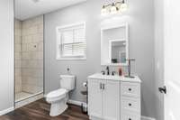 Private full bathroom with a tiled shower.