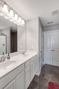 Master suite with double sinks and ample storage.  Walkin shower with door.