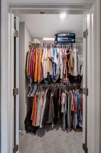 Mater Walkin closet with double doors.