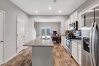 The kitchen island area has overhang for bar stools.