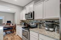 Tiled granite counter tops with rounded corners.  Tiled accent back splash.