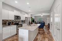 View from kitchen to front living room and front door.  Great flow for a family or entertaining.
