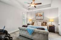 Primary bedroom w/custom accent wall, upgraded carpet & pad, plantation shutters