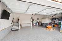 3 car garage w/epoxy floors, storm shelter & suspended storage