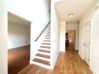 Formal living/dining to the left, kitchen and living room straight ahead!