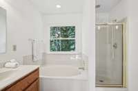Separate soaking tub and walk in shower!