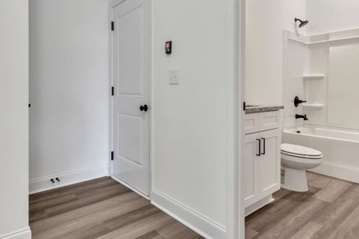 1st floor full bathroom and garage entry door.