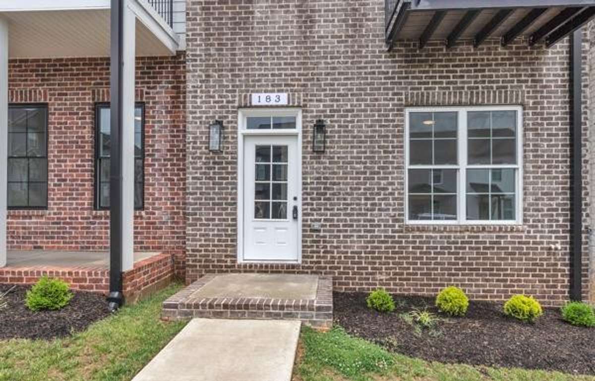 Perfect front porch and multiple balconies ready for your seasonal flowers & decor.