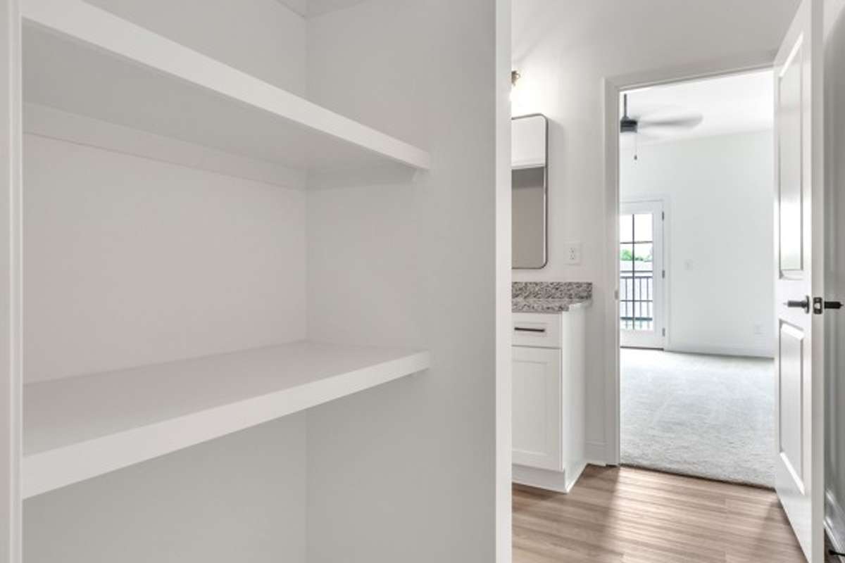 Additional open storage between owner's bath and owner's walk in closet.