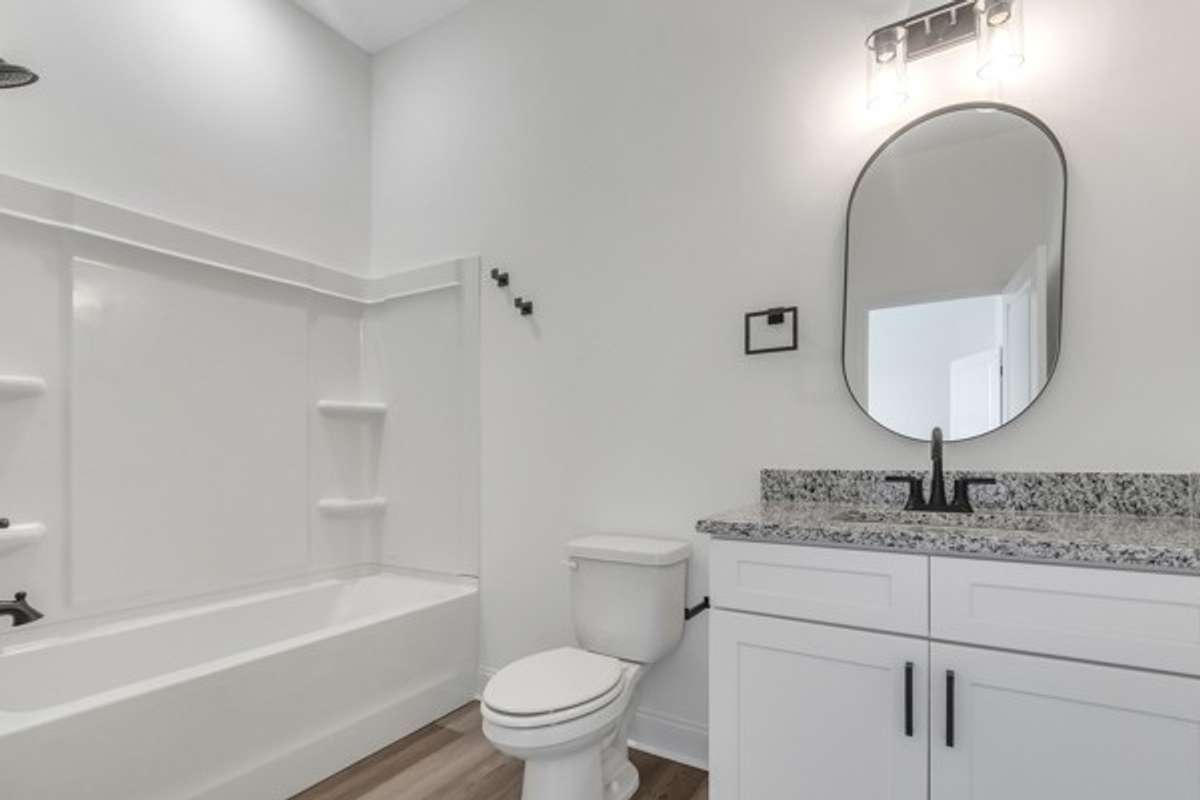 Private bathroom with 10 ft ceilings, modern decor and granite.