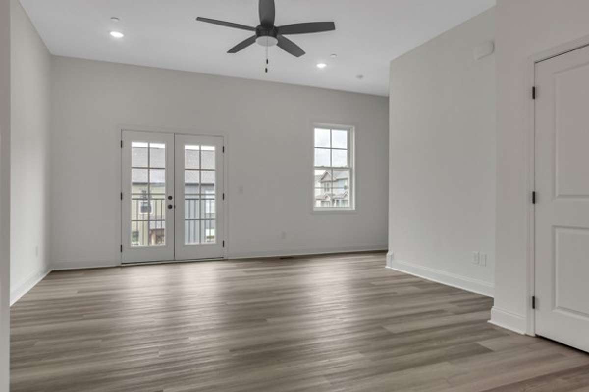 This gorgeous space features frenchdoors and a cozy deck on the front of home for access to extra lighting and fresh air!