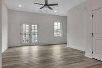 This gorgeous space features frenchdoors and a cozy deck on the front of home for access to extra lighting and fresh air!