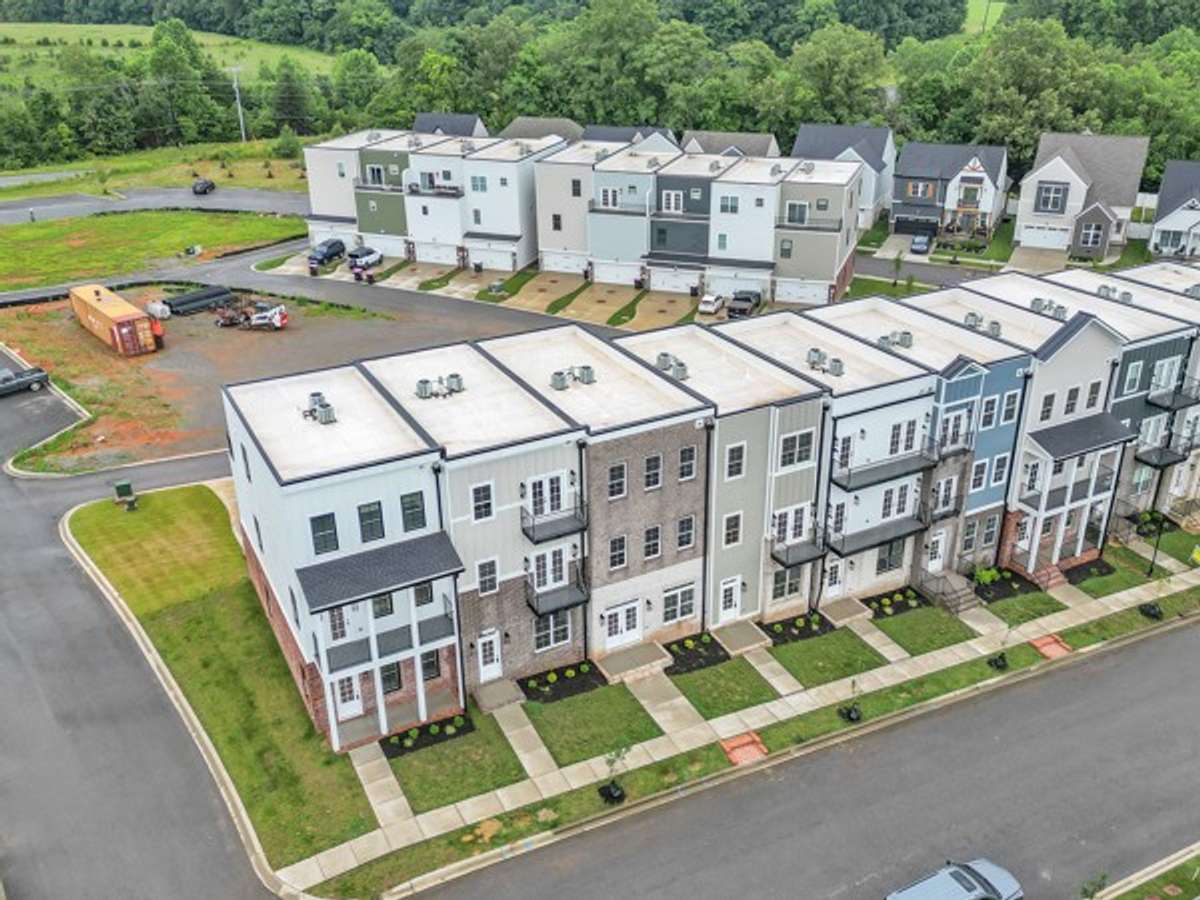 Pleasant View Village featuring luxury town homes tucked in the edge of the neighborhood known as The Charleston Commons.