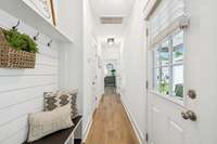 Continuing down the hall to the Half Bath & Primary Bedroom Suite!