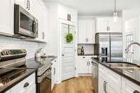 Stainless Appliance includes Microwave Hood, Smooth-top Oven, Dishwasher & Fridge!