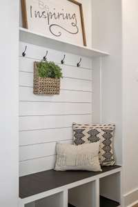 Easy spot for the kids to drop bookbags.. love the cubbies for shoe storage!