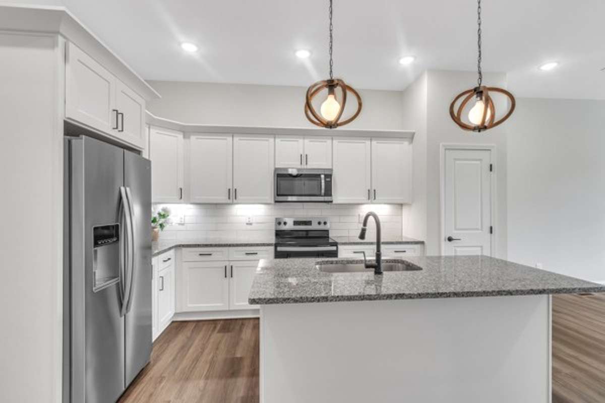 The 2nd floor features the kitchen, living space and a guest bedroom with a walk in closet and full bath on this floor.