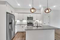 The 2nd floor features the kitchen, living space and a guest bedroom with a walk in closet and full bath on this floor.