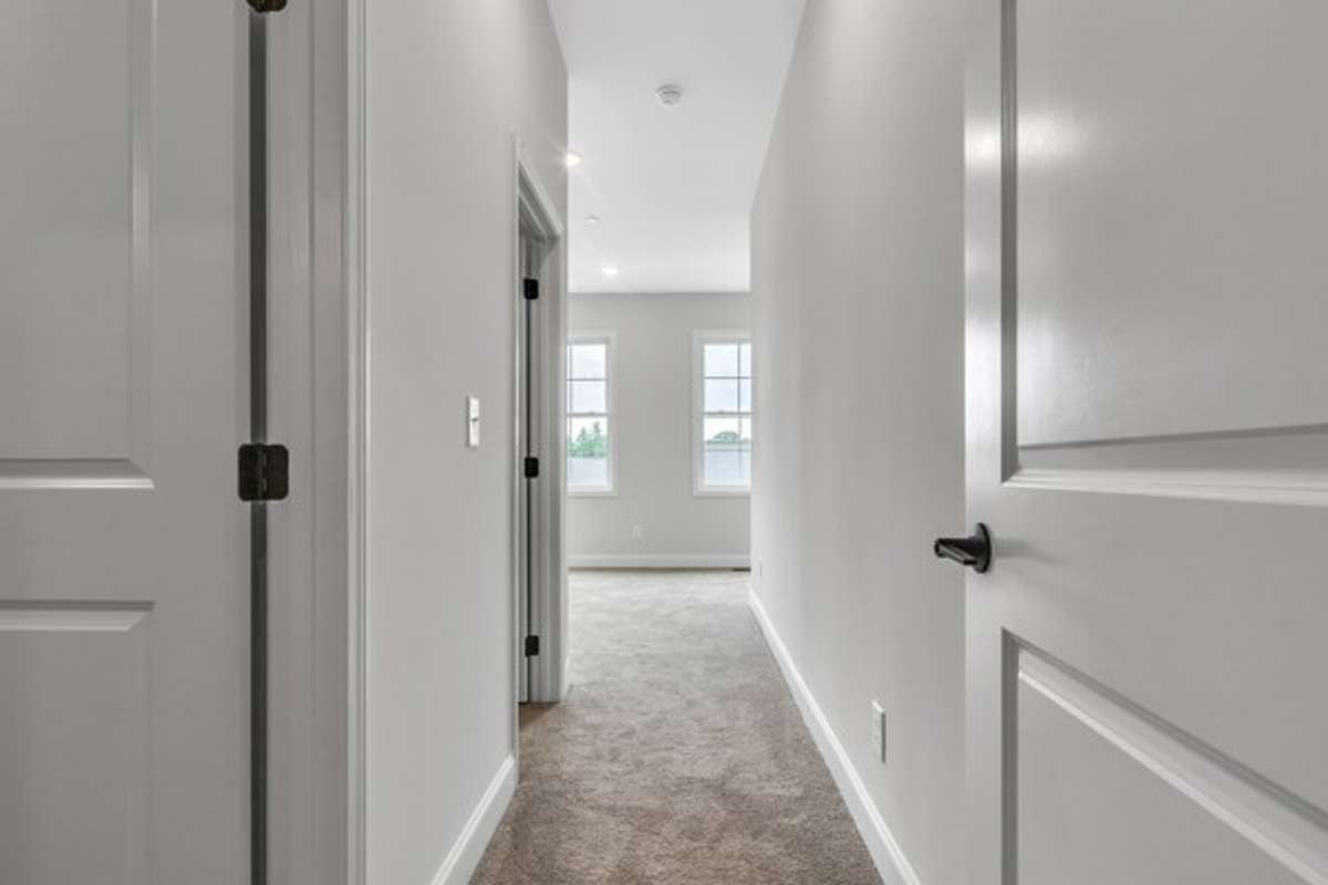 As you enter owner's retreat, you notice the soaring ceilings, multiple windows and lots of light streaming in with the primary bath immediately on the left followed by the owner's walk-in closet.