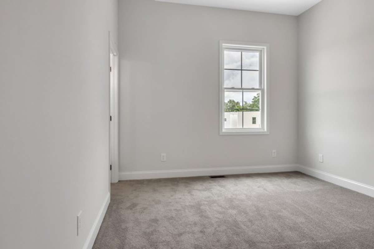 2nd guest bedroom with 10 ft high ceiling, modern ceiling fan & lighting with a private full bath.