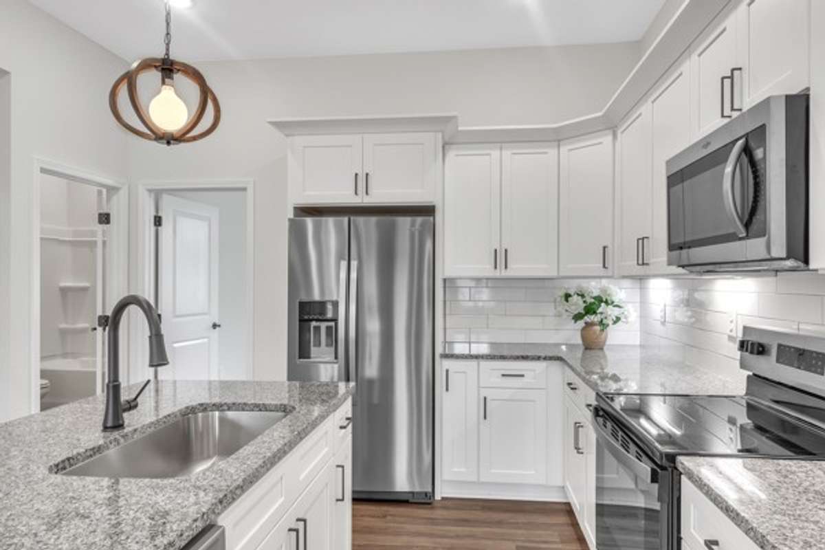 The guest bedroom is conveniently located just off the kitchen.