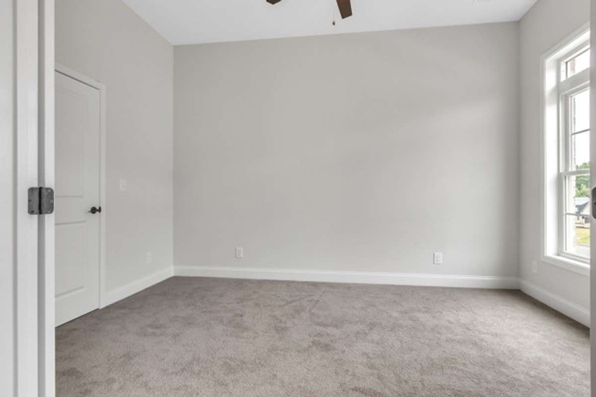 Immediately off the foyer! With french doors, 10 ft ceilings, With modern ceiling fan, double windows with a transom window above it make this private office/flex room is bright and inviting.