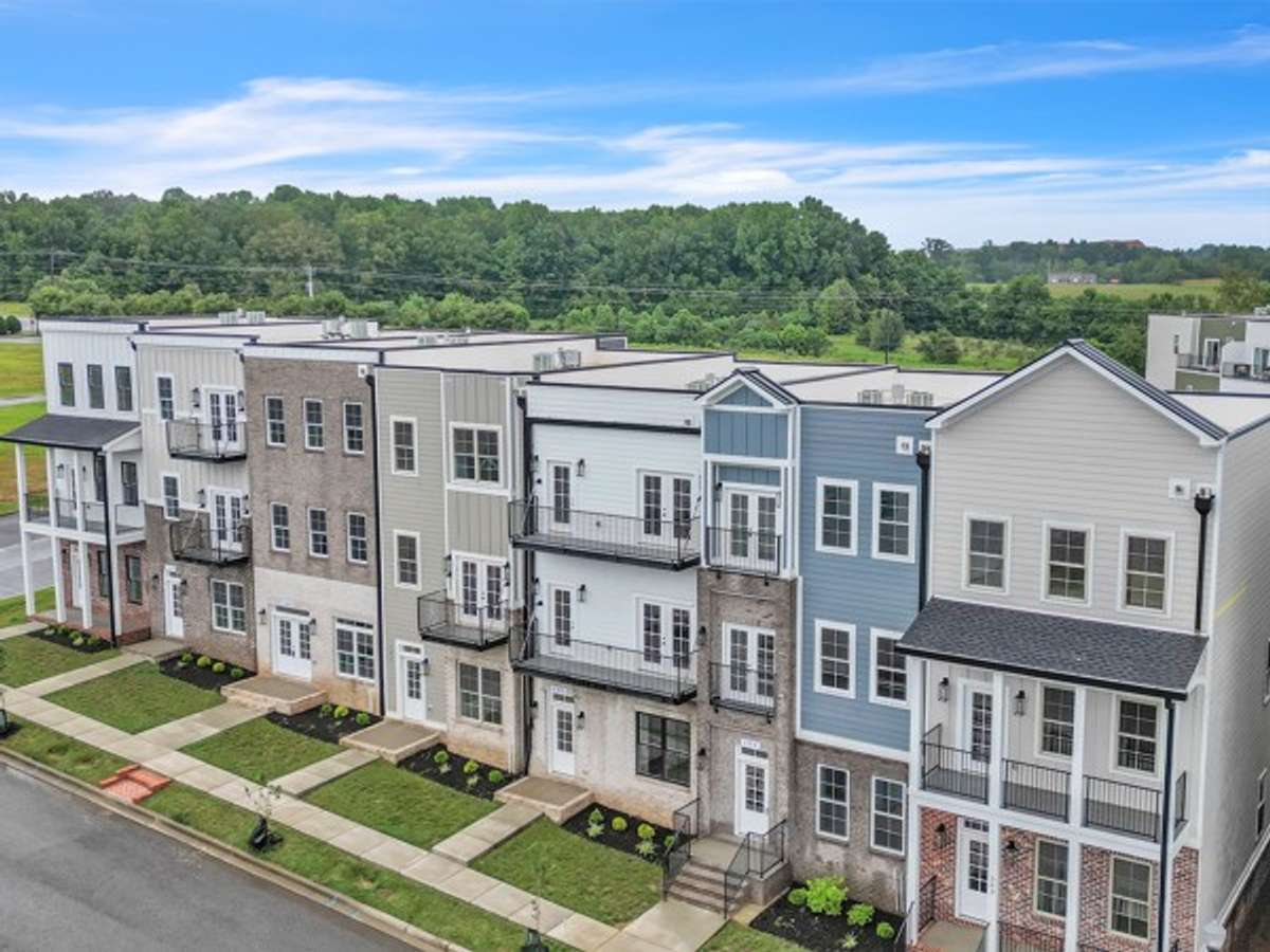 A beautiful shot of the 7 town home units each with its own unique design & features! Notice the sidewalks that run through out Pleasant View Village.