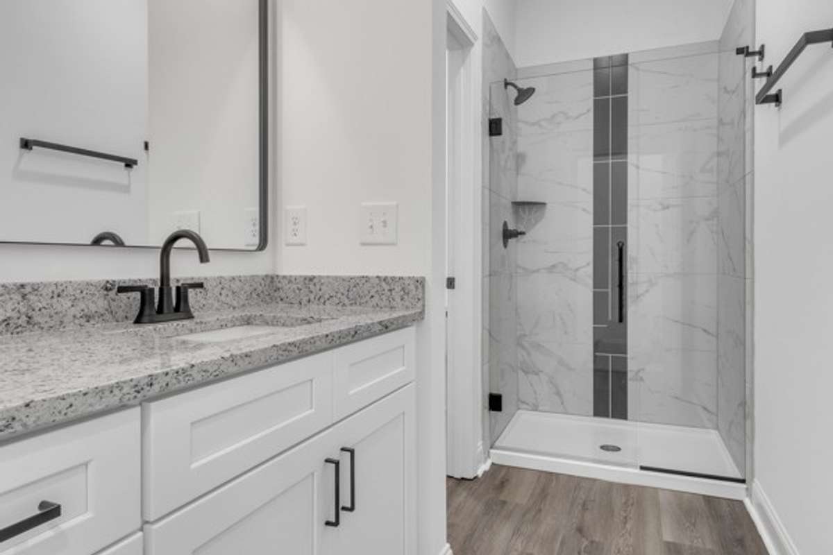 With 10ft ceilings, granite & elegant tile this owner's bath has a real spa feeling. (Private water closet area to left of shower)