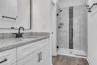 With 10ft ceilings, granite & elegant tile this owner's bath has a real spa feeling. (Private water closet area to left of shower)