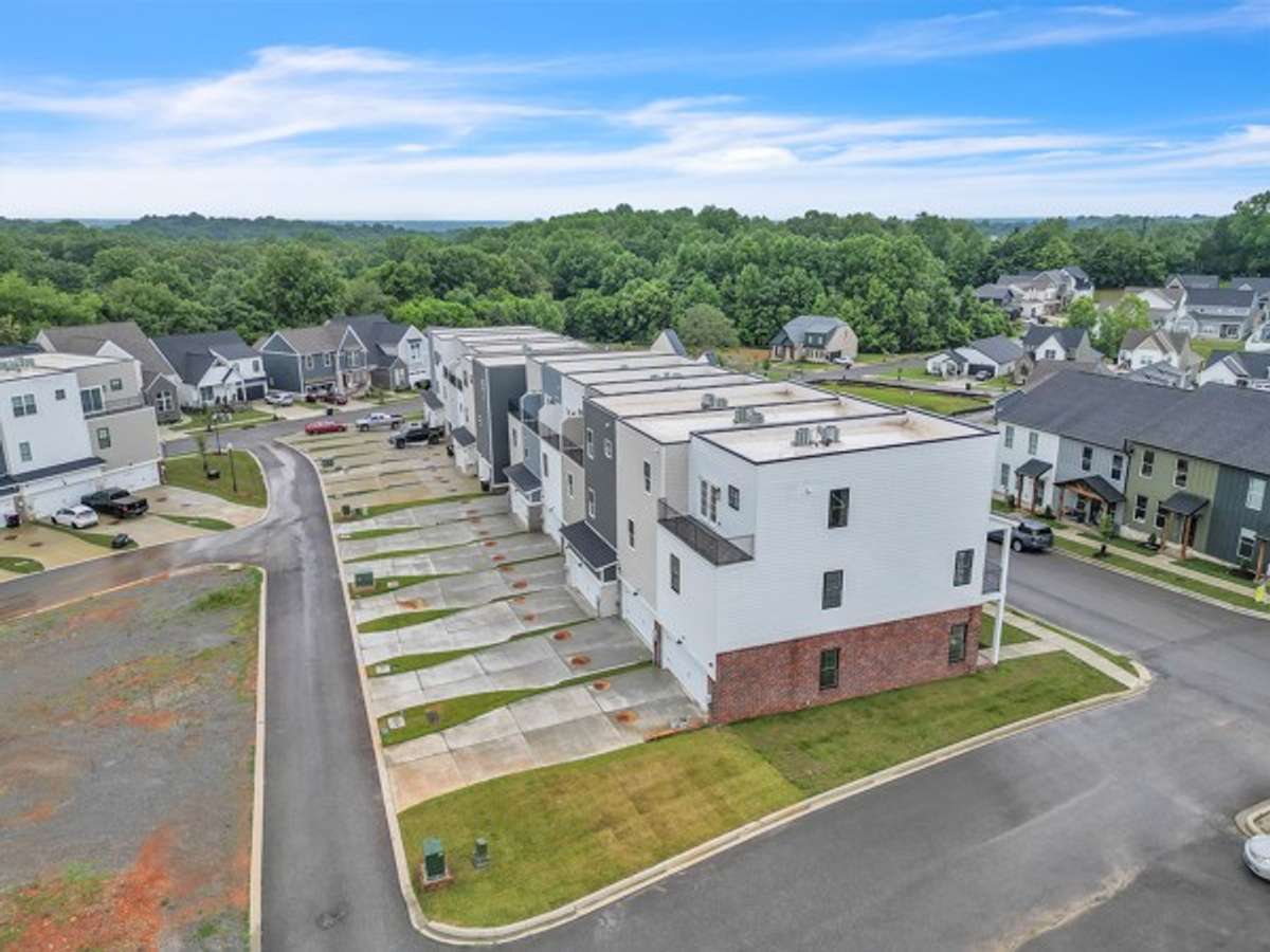 A great shot of the long private driveways & 2 car garages to these 7 unique townhomes.