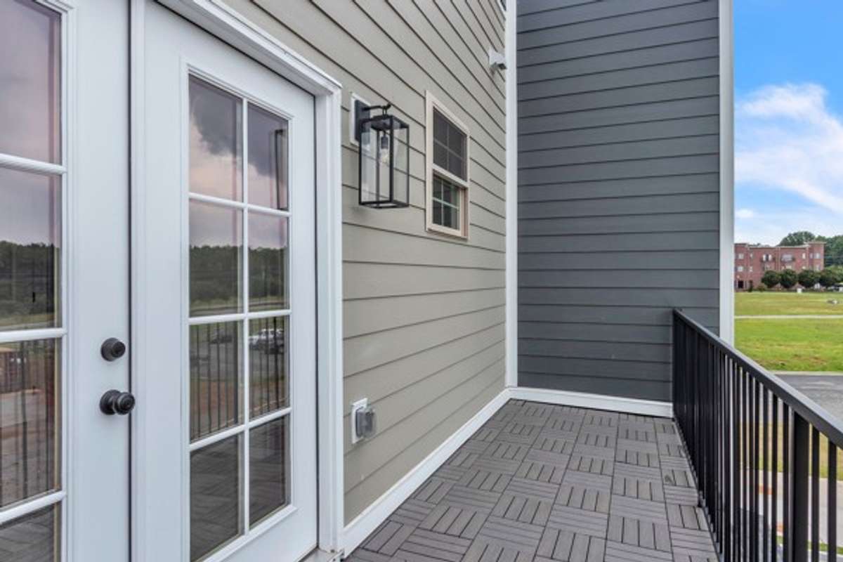 What a great area for guests to enjoy private time in the morning and evening. Another great view of the local neighborhood restaurants. Notice the added window to provide more light to the guest bath.