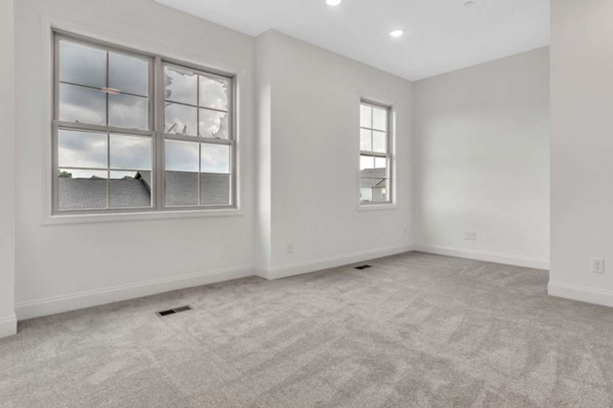 This room is large! With 10 ft ceilings, great lighting and 3 windows the is a perfect owner's retreat from which to start and end the day. The nook area would be perfect styled as a cozy reading area or entertainment center.