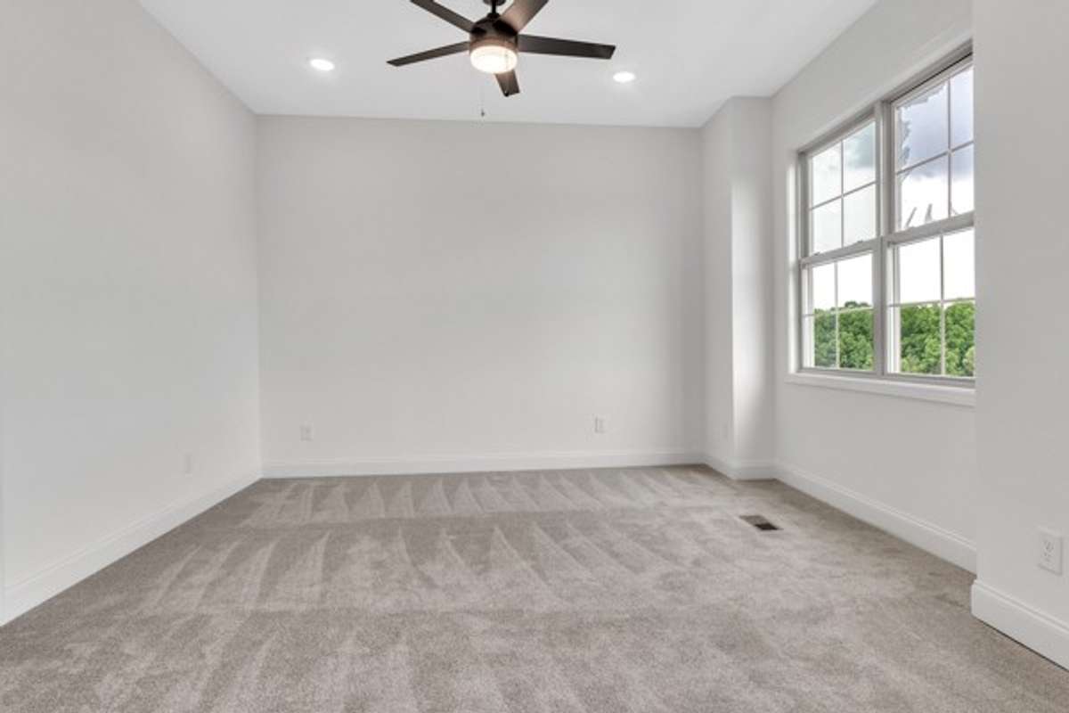 A shot from the nook area of owner's retreat. Notice all the modern ceiling fans through out the home.