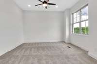 A shot from the nook area of owner's retreat. Notice all the modern ceiling fans through out the home.