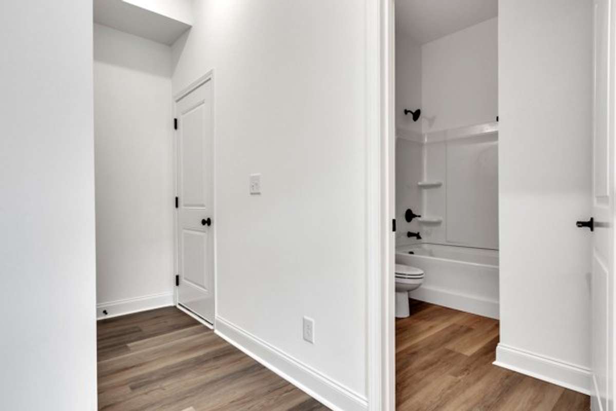 Off the foyer is a full bath and the entryway to the 2 car garage.