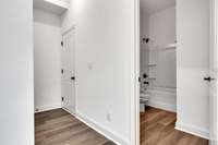 Off the foyer is a full bath and the entryway to the 2 car garage.